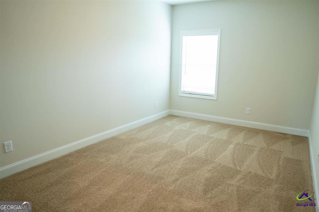 119 Bluecoat Trail Byron, GA 31008 - Photo 10 of 37 an empty room with a window