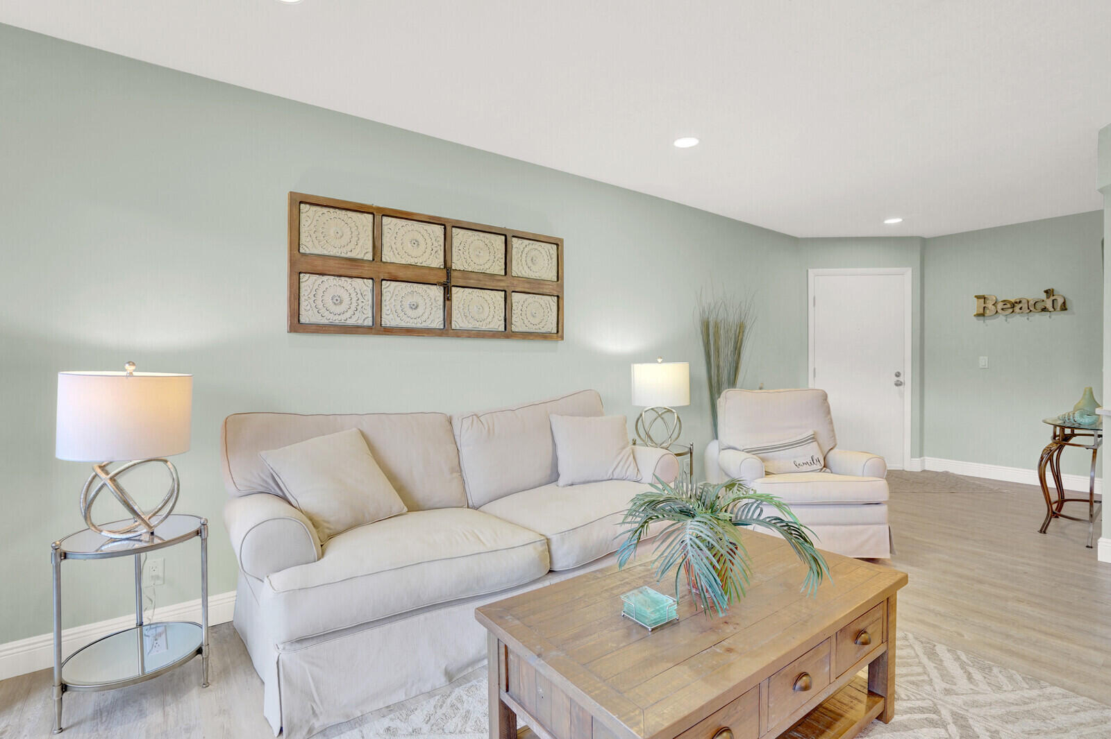 1605 Highway 1, Unit 202V5 Jupiter, FL 33477 - Photo 5 of 26 a living room with furniture and a table