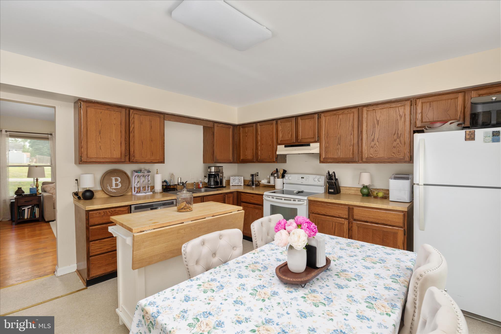 208 North Rappahannock Street Remington, VA 22734 - Photo 8 of 21 a kitchen with a refrigerator stove top oven and sink
