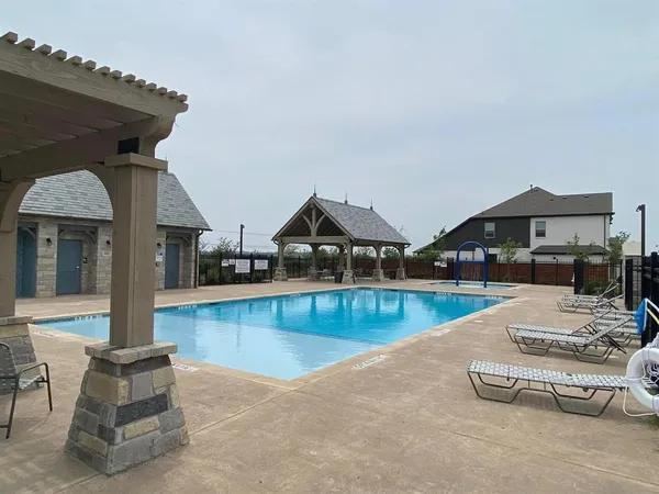 a view of a patio with swimming pool