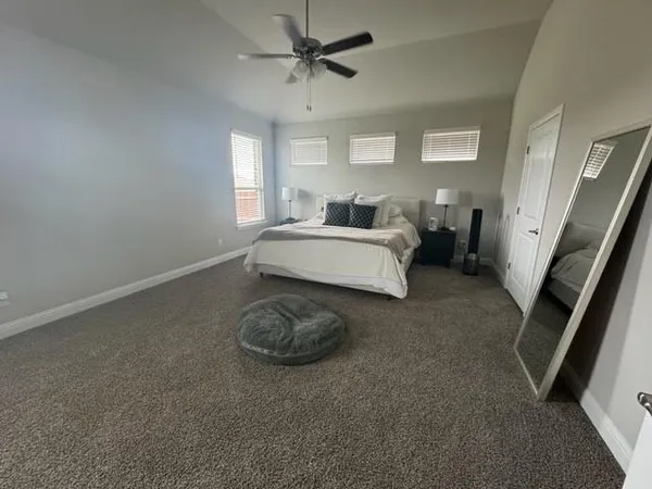 a living room with furniture and a rug