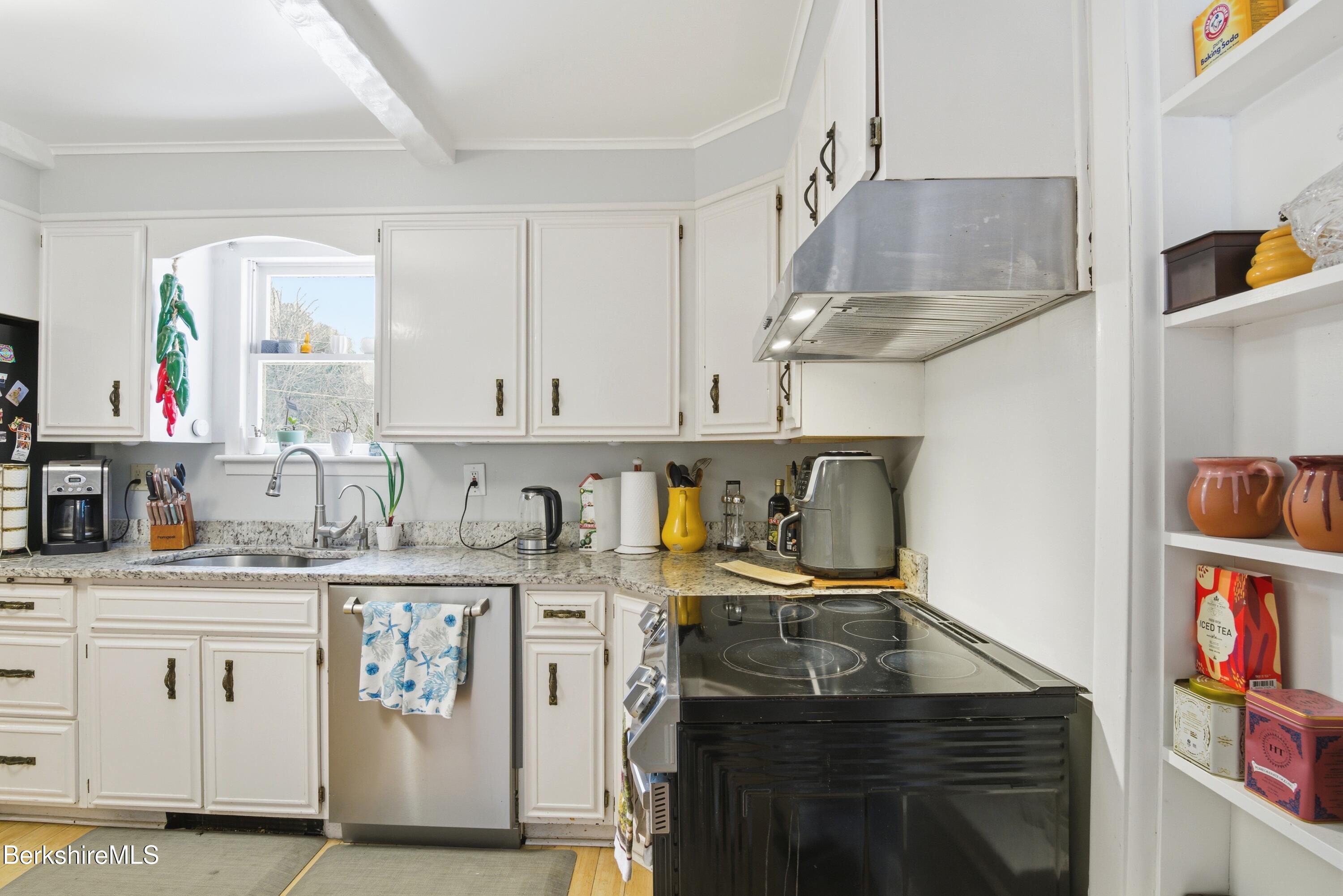 6 Vine Street Pittsfield, MA 01201 - Photo 12 of 37 a kitchen with stainless steel appliances granite countertop a sink and cabinets