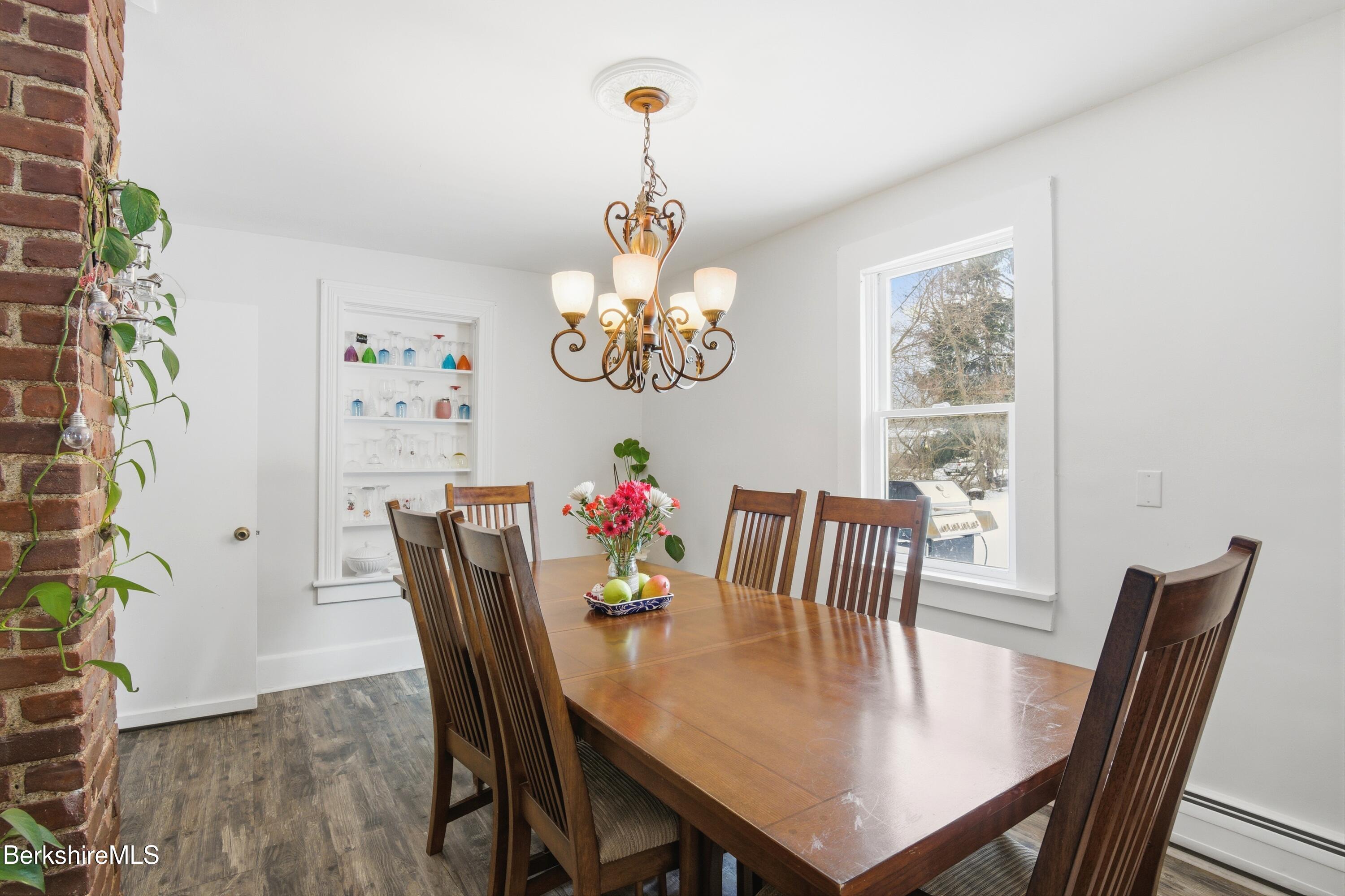 6 Vine Street Pittsfield, MA 01201 - Photo 16 of 37 a view of a dining room with furniture window and wooden floor