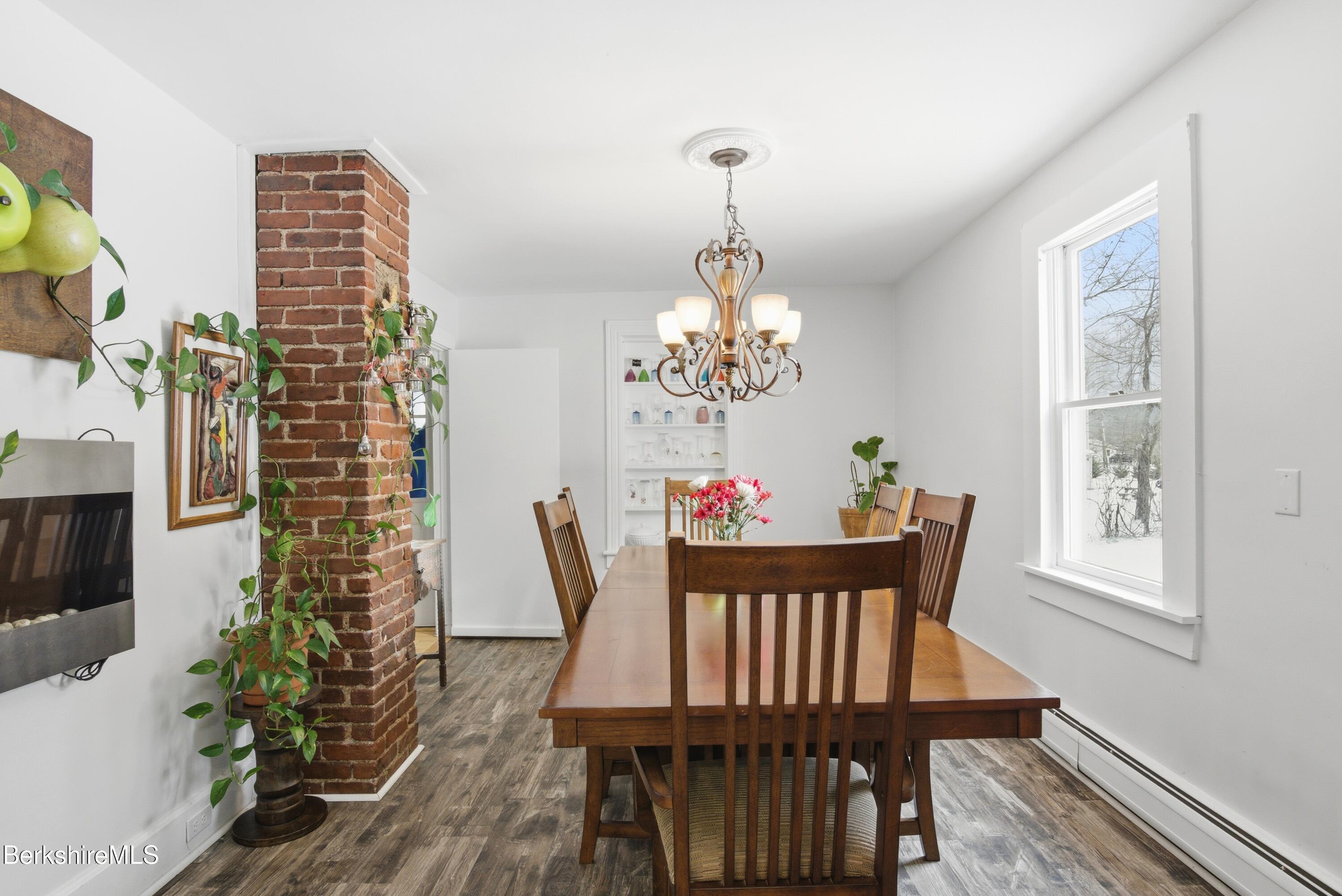 6 Vine Street Pittsfield, MA 01201 - Photo 17 of 37 a view of a dining room with furniture window and wooden floor