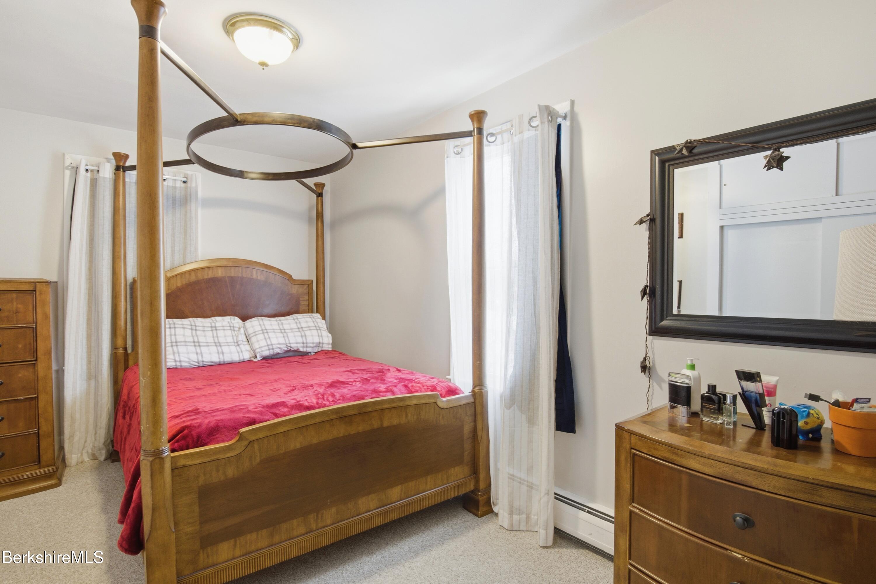 6 Vine Street Pittsfield, MA 01201 - Photo 21 of 37 a bedroom with a bed and a dresser