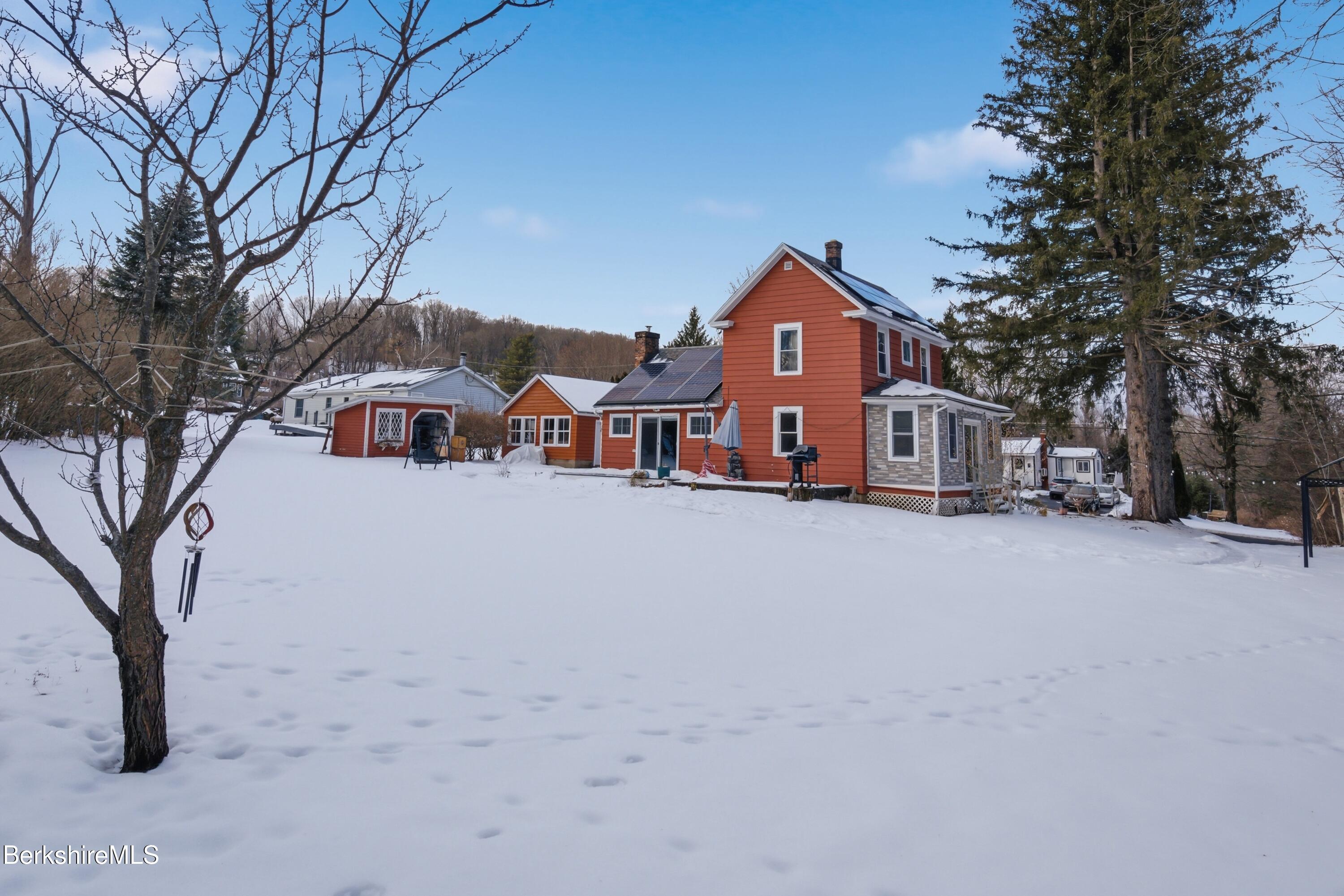 6 Vine Street Pittsfield, MA 01201 - Photo 36 of 37 a front view of a house with a yard covered in snow