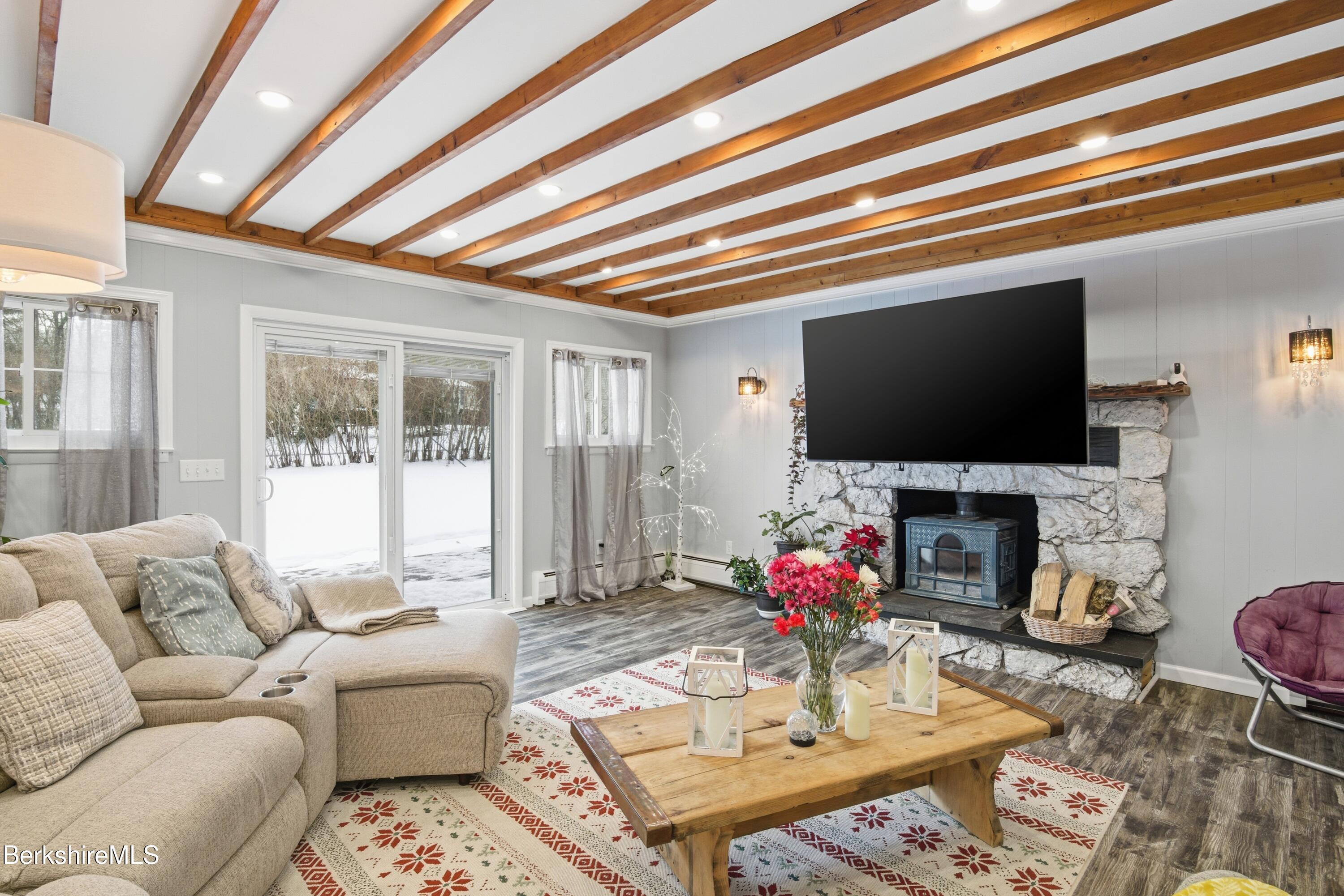 6 Vine Street Pittsfield, MA 01201 - Photo 5 of 37 a living room with fireplace furniture and a flat screen tv