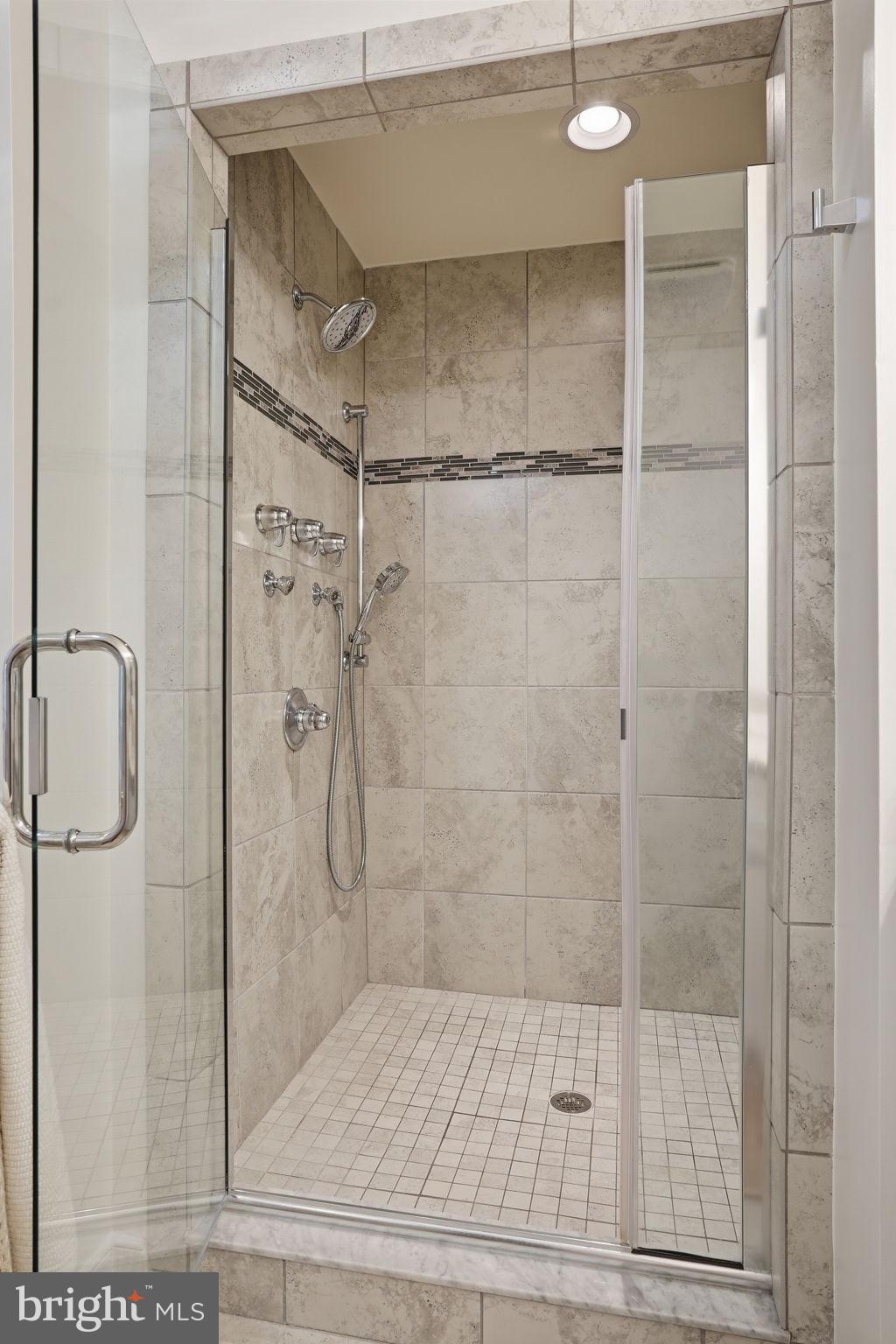 126 Admirals Ridge Drive Arnold, MD 21012 - Photo 20 of 58 a bathroom with a glass shower door