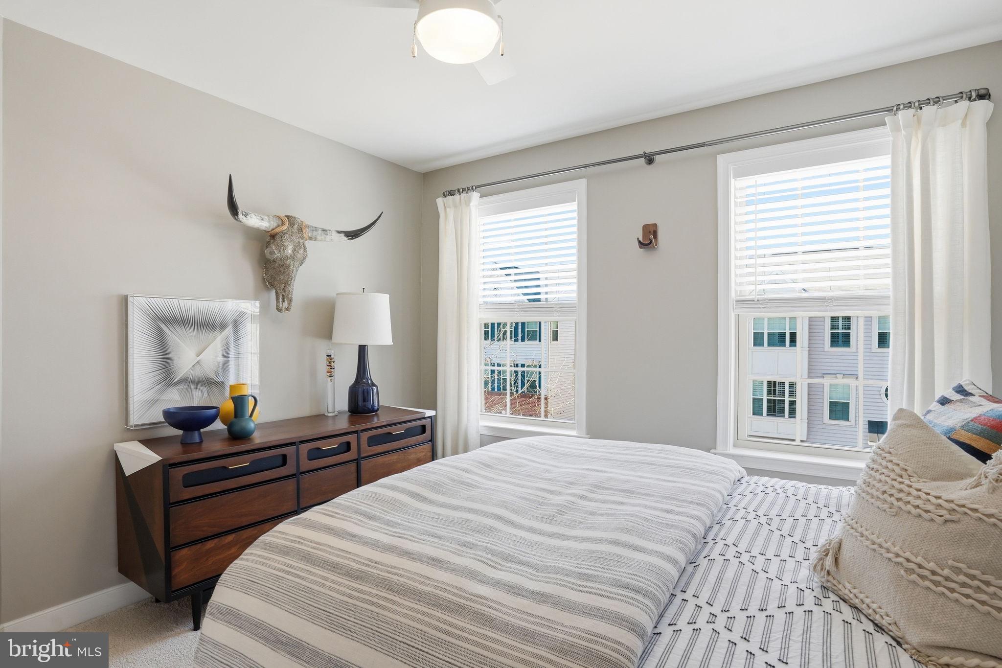 126 Admirals Ridge Drive Arnold, MD 21012 - Photo 26 of 58 a bedroom with a bed and wooden floor