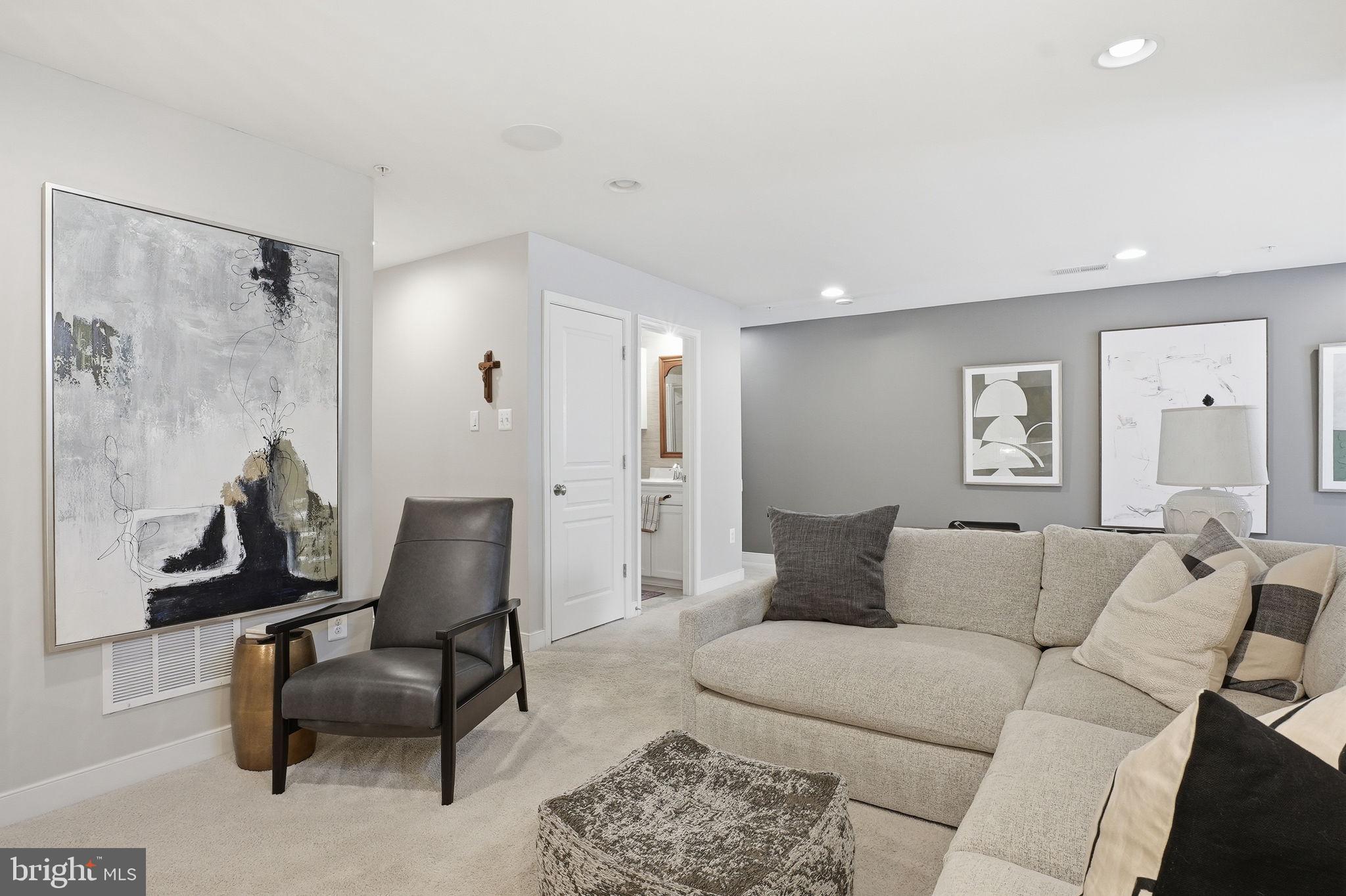 126 Admirals Ridge Drive Arnold, MD 21012 - Photo 31 of 58 a living room with furniture and a painting on the wall