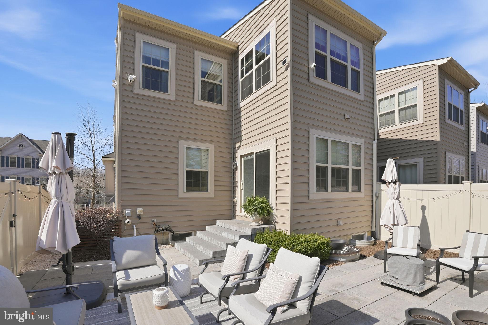 126 Admirals Ridge Drive Arnold, MD 21012 - Photo 34 of 58 a view of a patio with a table and chairs