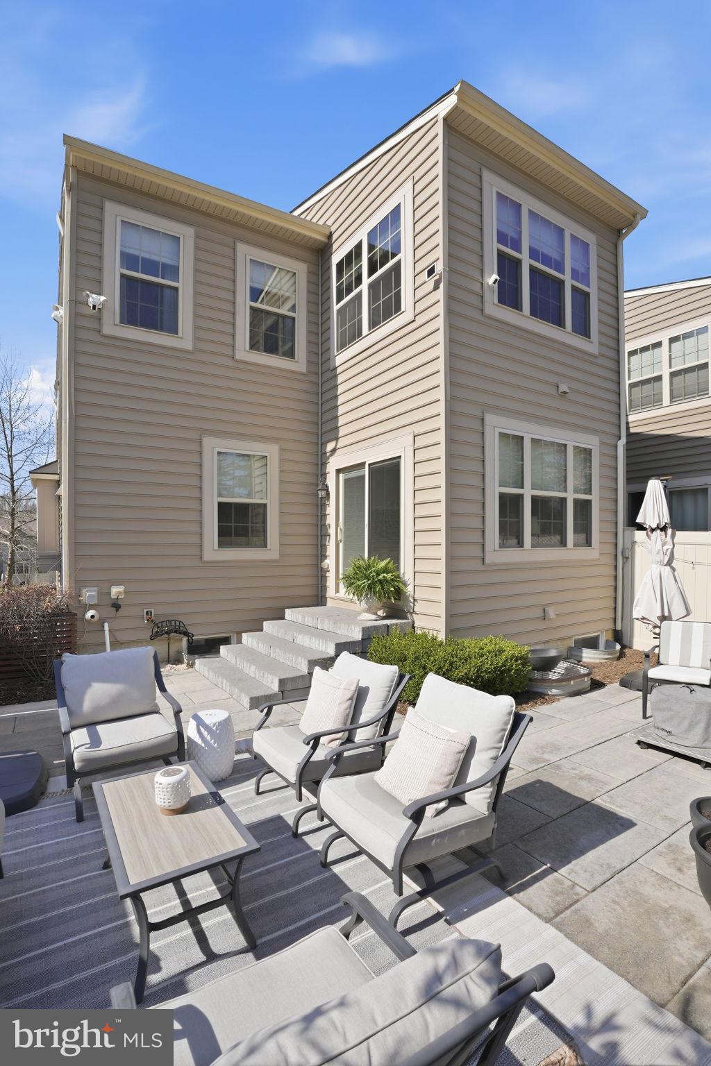 126 Admirals Ridge Drive Arnold, MD 21012 - Photo 39 of 58 a backyard of a house with outdoor seating