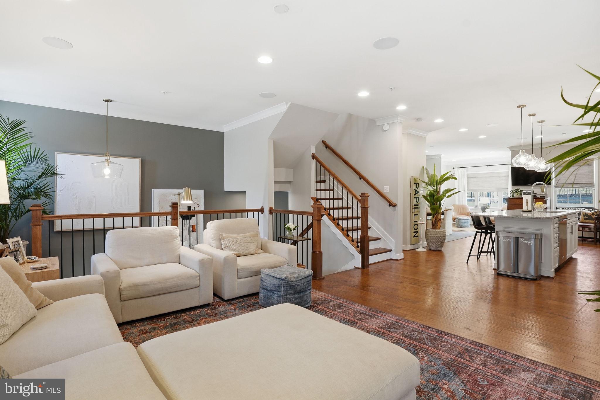 126 Admirals Ridge Drive Arnold, MD 21012 - Photo 7 of 58 a living room with fireplace furniture and a wooden floor