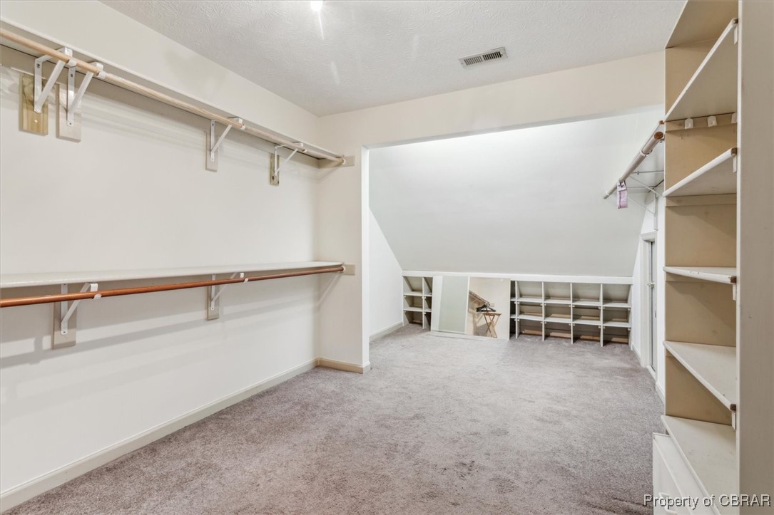 1318 Showalter Road Yorktown, VA 23692 - Photo 22 of 47 Spacious primary closet featuring carpet floors