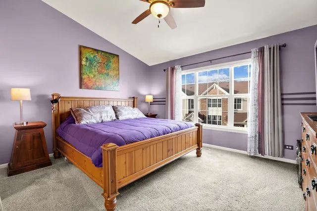 a spacious bedroom with a bed and a window