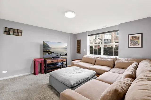 a living room with furniture and a window