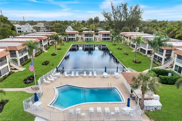a view of a swimming pool with a yard