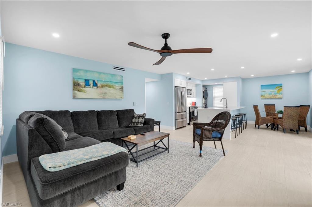 1155 Sandpiper Street, Unit C7 Naples, FL 34102 - Photo 2 of 23 a living room with furniture