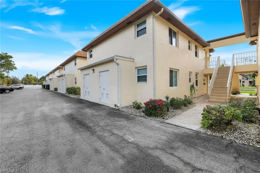 1155 Sandpiper Street, Unit C7 Naples, FL 34102 - Photo 22 of 23 a view of a house with backyard