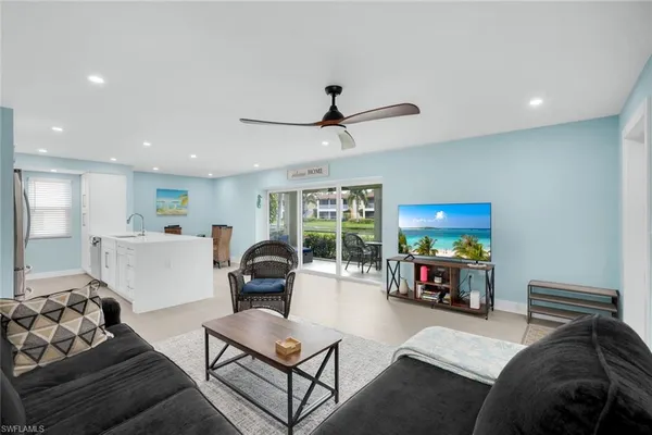 a living room with furniture and a flat screen tv