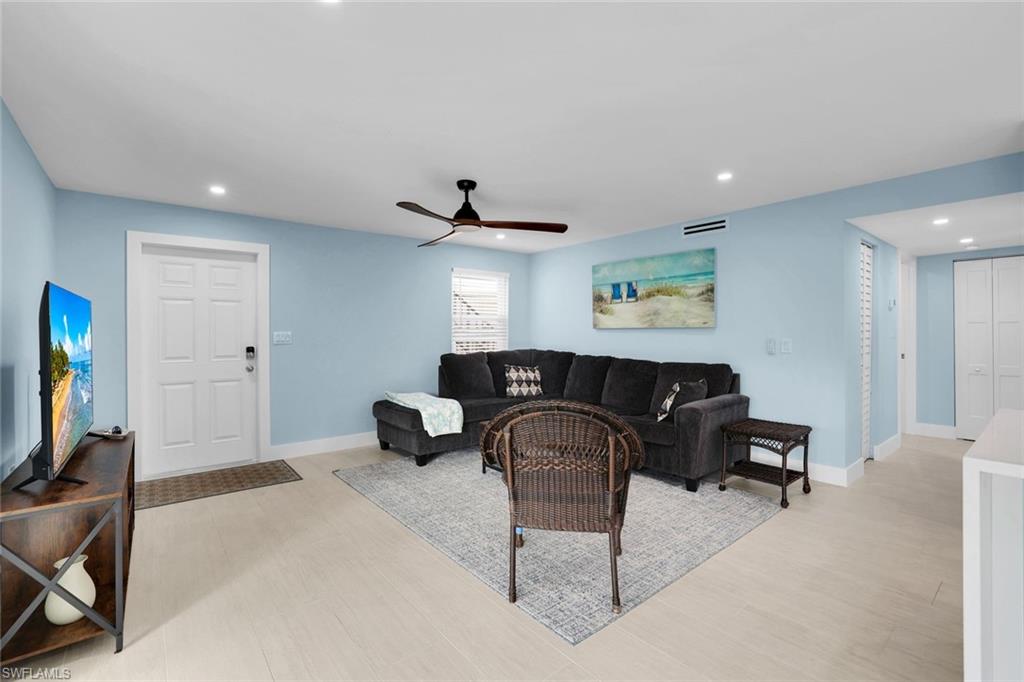 1155 Sandpiper Street, Unit C7 Naples, FL 34102 - Photo 4 of 23 a living room with furniture