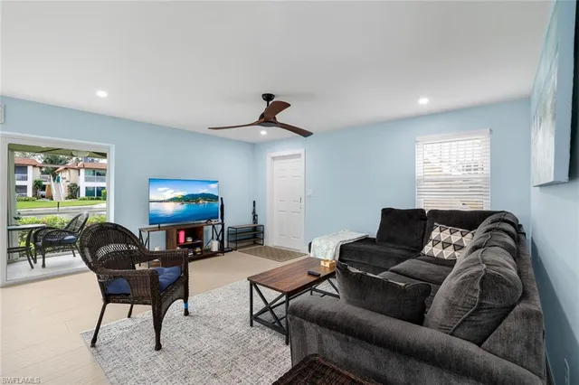 a living room with furniture and a flat screen tv
