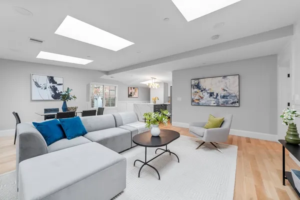 a living room with furniture and a rug