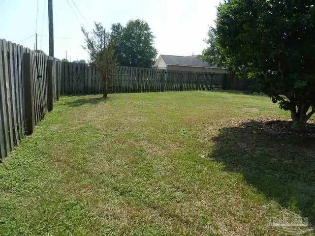 a view of a backyard with a cabin