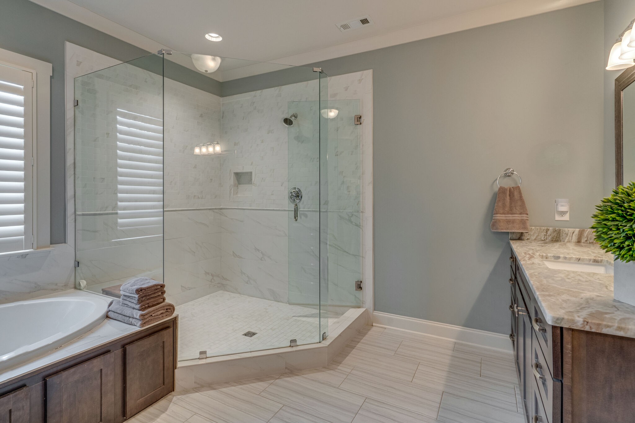 2218 Dunblane Lane Franklin, TN 37069 - Photo 18 of 23 a bathroom with a granite countertop sink a toilet and shower