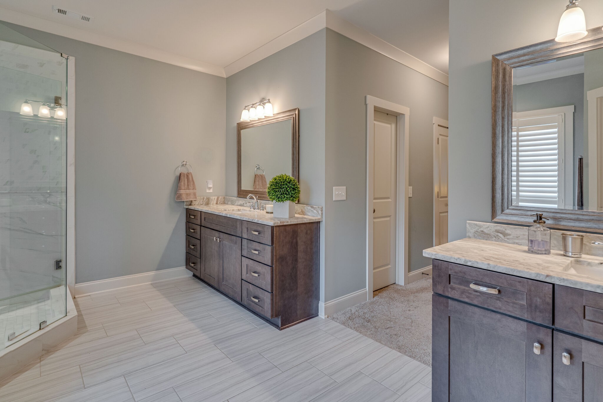 2218 Dunblane Lane Franklin, TN 37069 - Photo 19 of 23 a bathroom with a double vanity sink a mirror and a shower