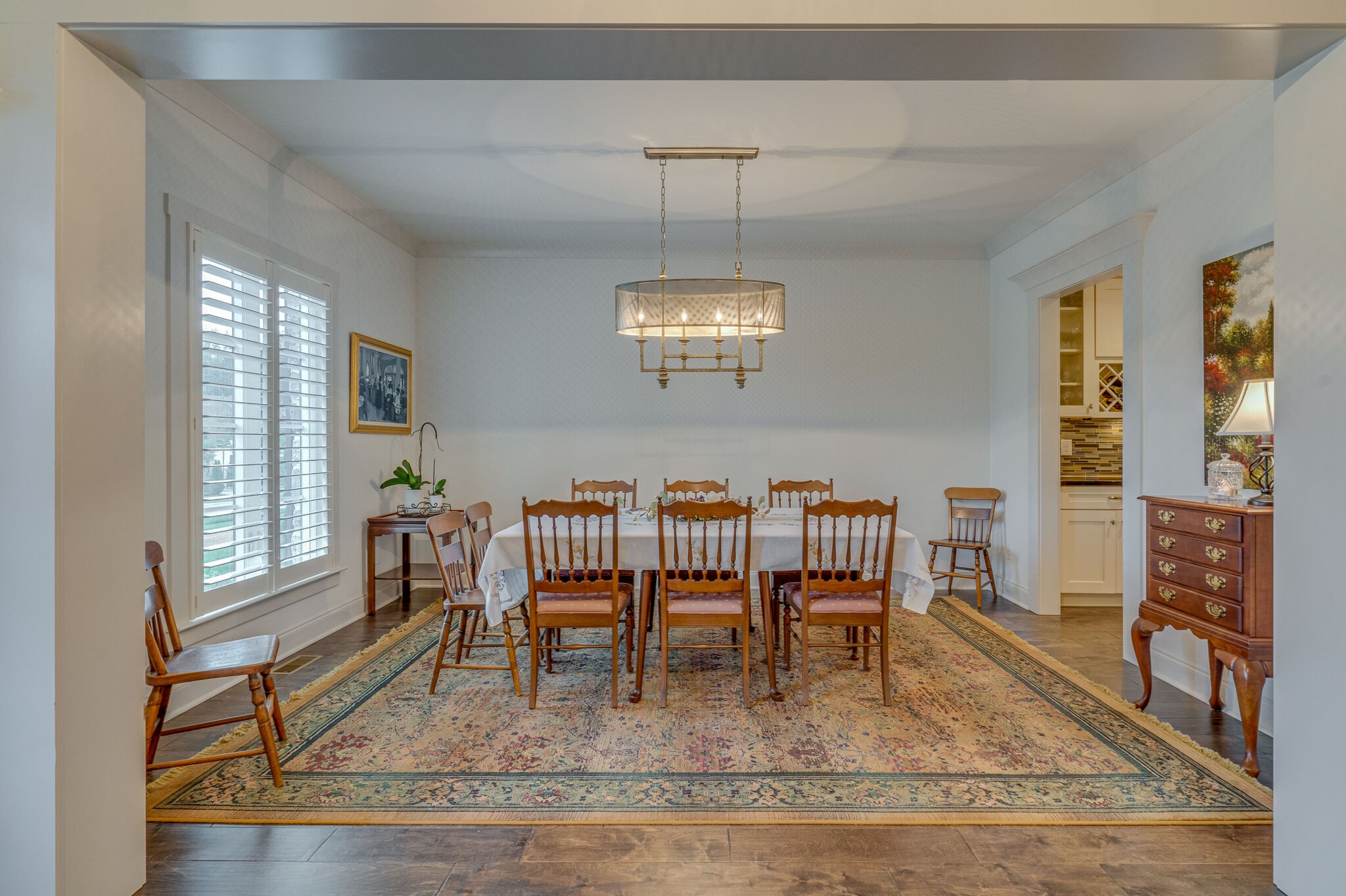 2218 Dunblane Lane Franklin, TN 37069 - Photo 6 of 23 a dining room with furniture a rug and wooden floor