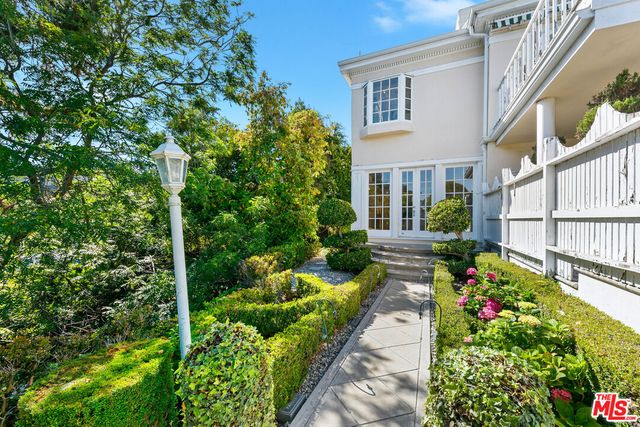 a view of an entryway with wooden floor and windows