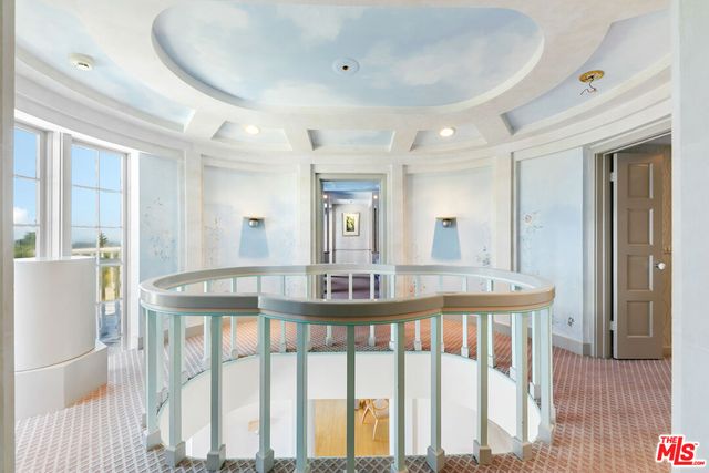 a bathroom with a toilet a sink and a mirror