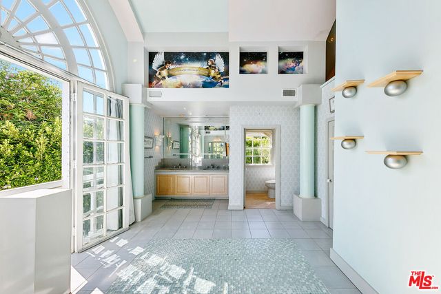 a kitchen with stainless steel appliances kitchen island a sink stove and microwave