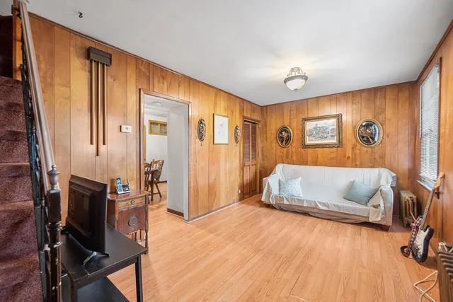 a bedroom with furniture and a wooden floor