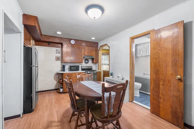 a view of a dining room with furniture window and wooden floor