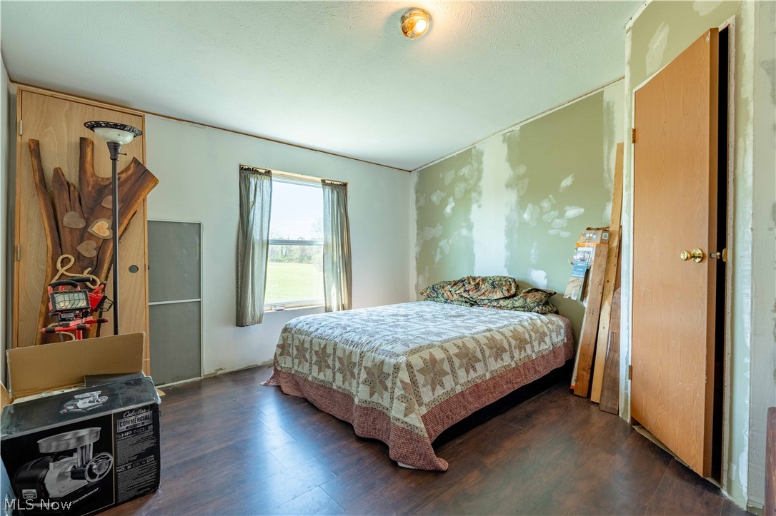 5267 Apollo Road Northeast Salineville, OH 43945 - Photo 18 of 33 Bedroom featuring wood finished floors