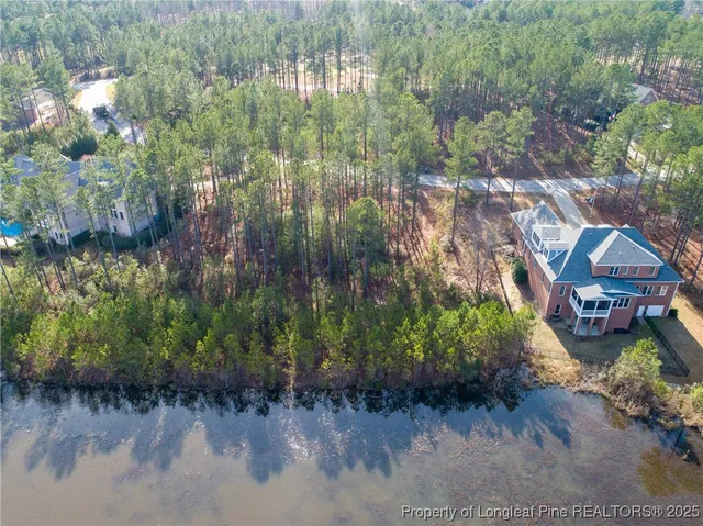 a view of a lake with a yard