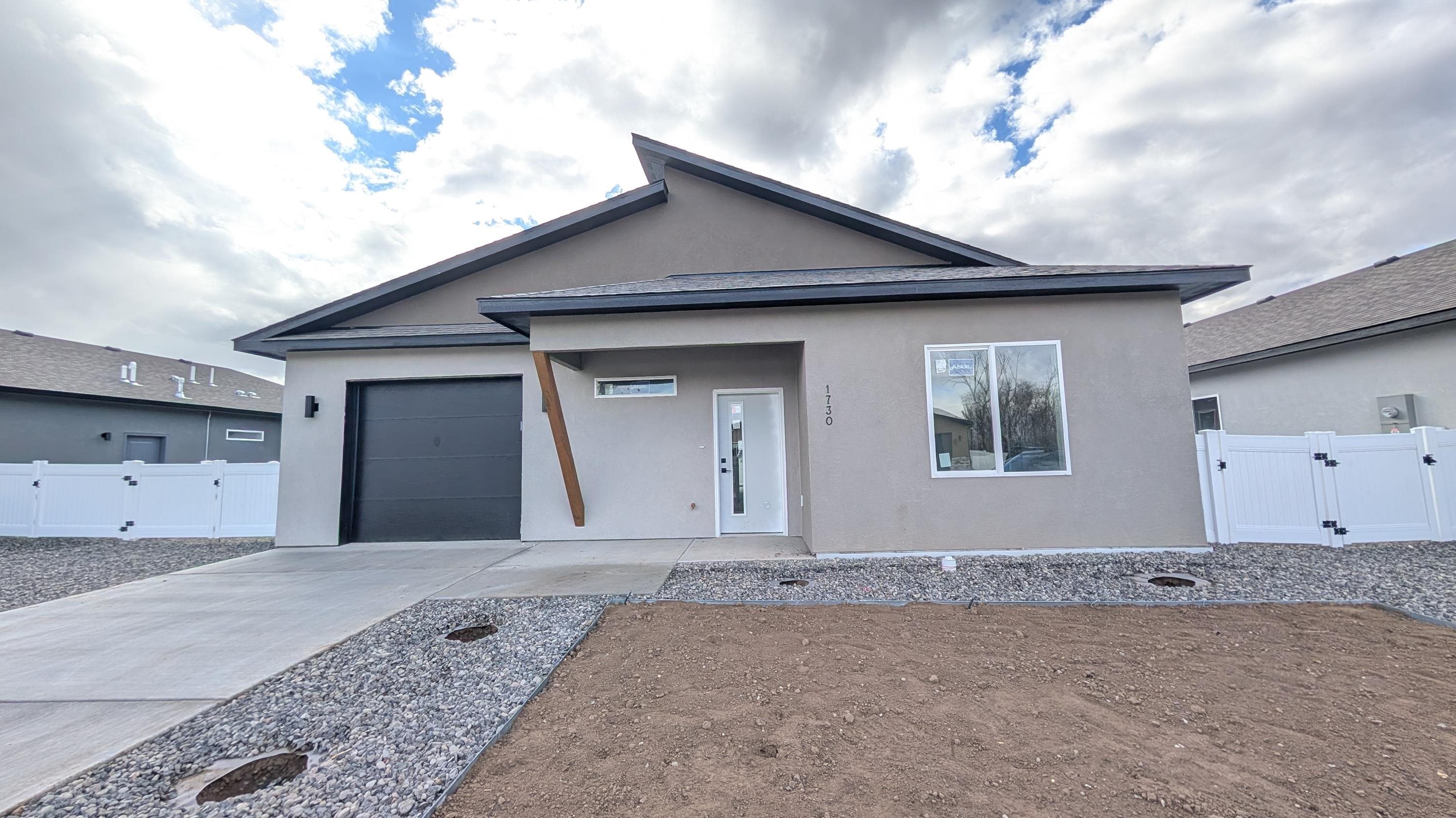 a front view of a house with a garage
