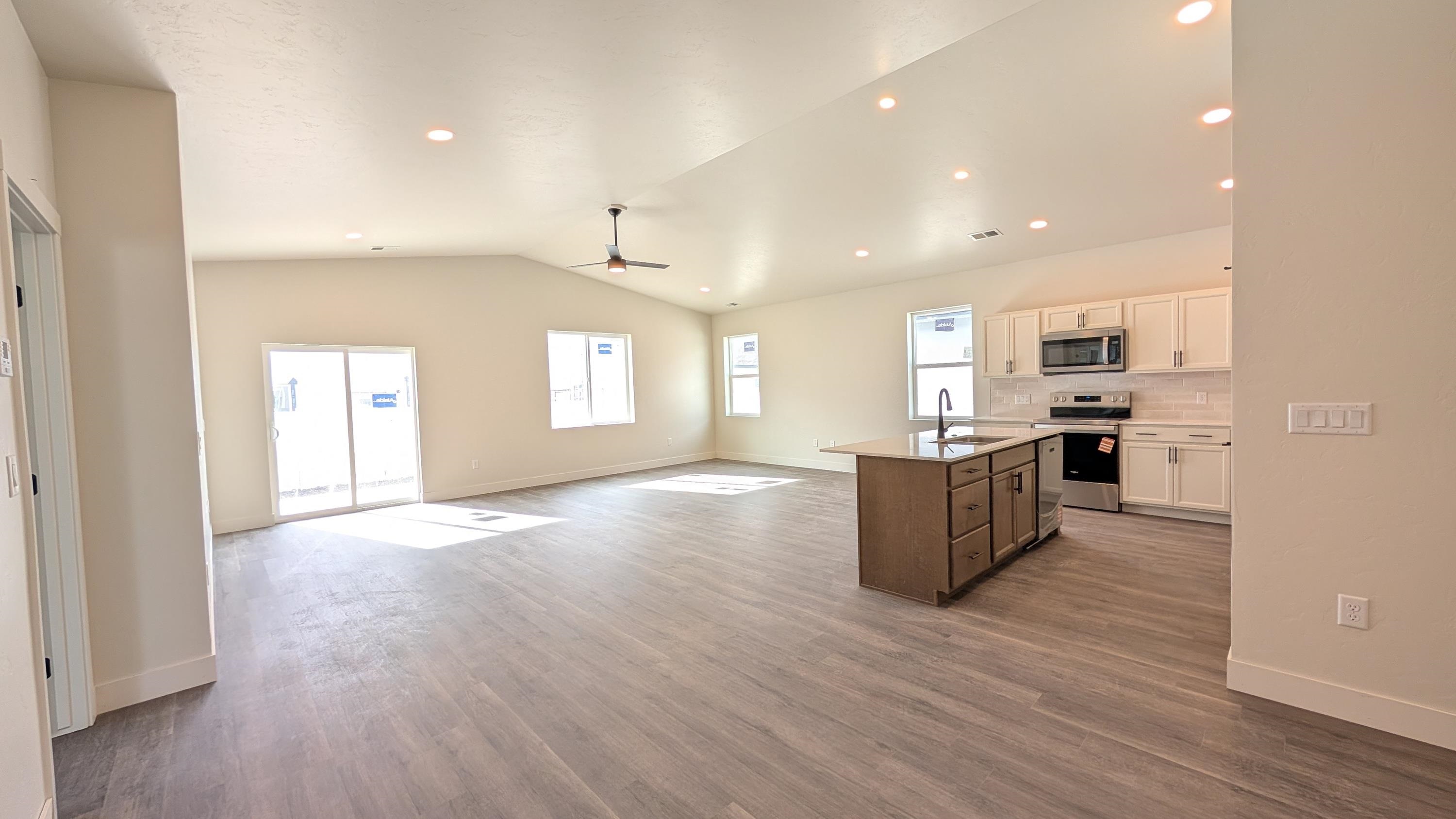 1730 Caliper Way Fruita, CO 81521 - Photo 4 of 15 a view of kitchen and kitchen with a sink oven cabinets