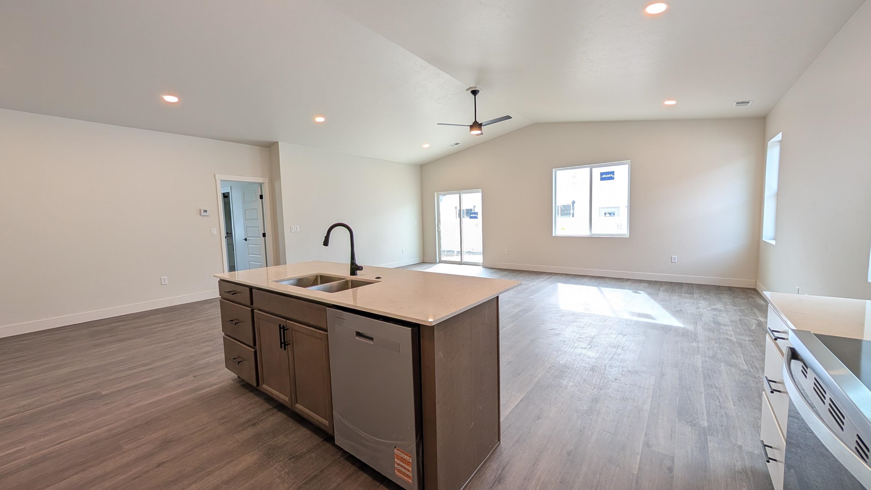 1730 Caliper Way Fruita, CO 81521 - Photo 6 of 15 a kitchen with a sink and wooden floor