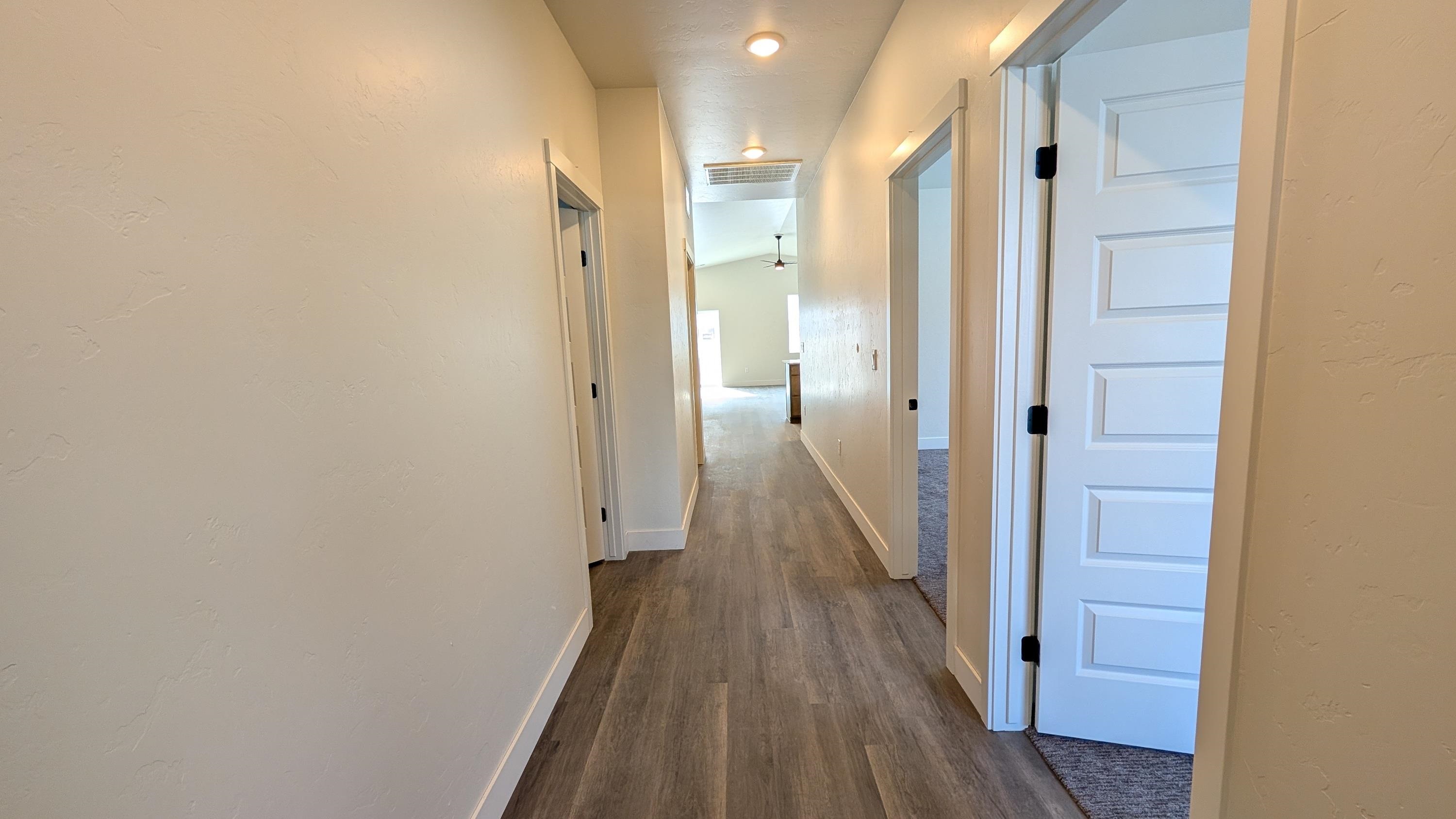 1730 Caliper Way Fruita, CO 81521 - Photo 7 of 15 a view of a bathroom from the hallway