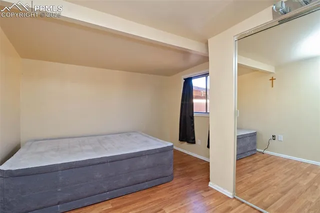a view of livingroom with hardwood floor and hallway