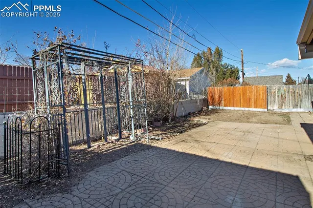 a view of the house with a yard
