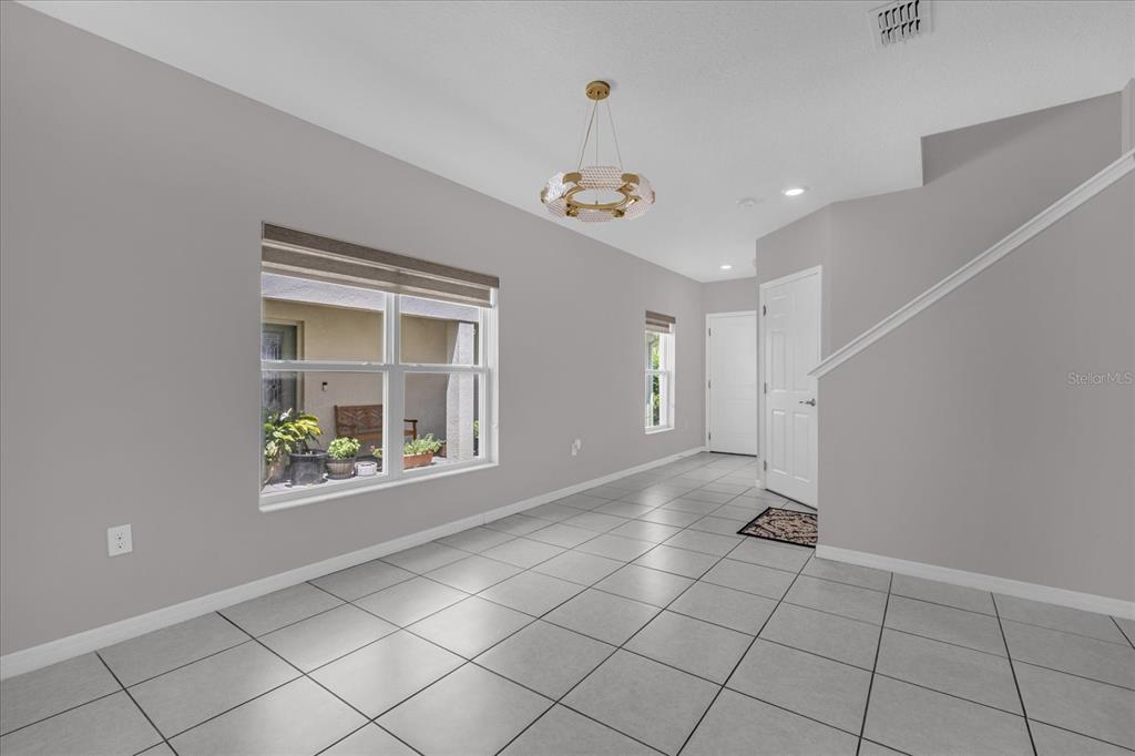 3470 Beau Road Kissimmee, FL 34746 - Photo 10 of 40 a view of an empty room with a window