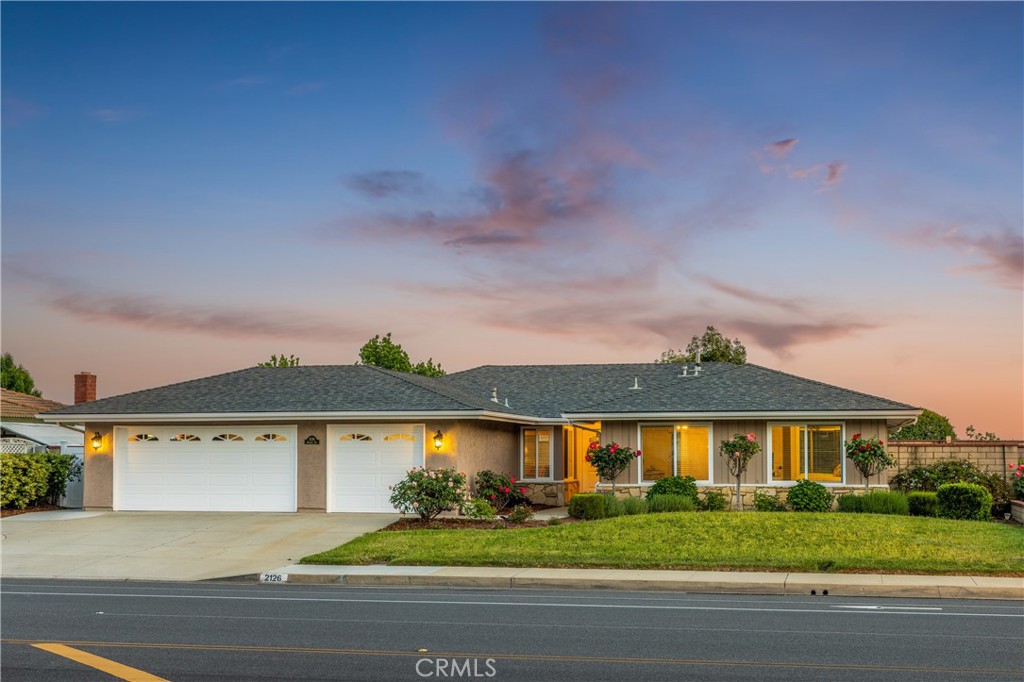 front view of a house with a yard