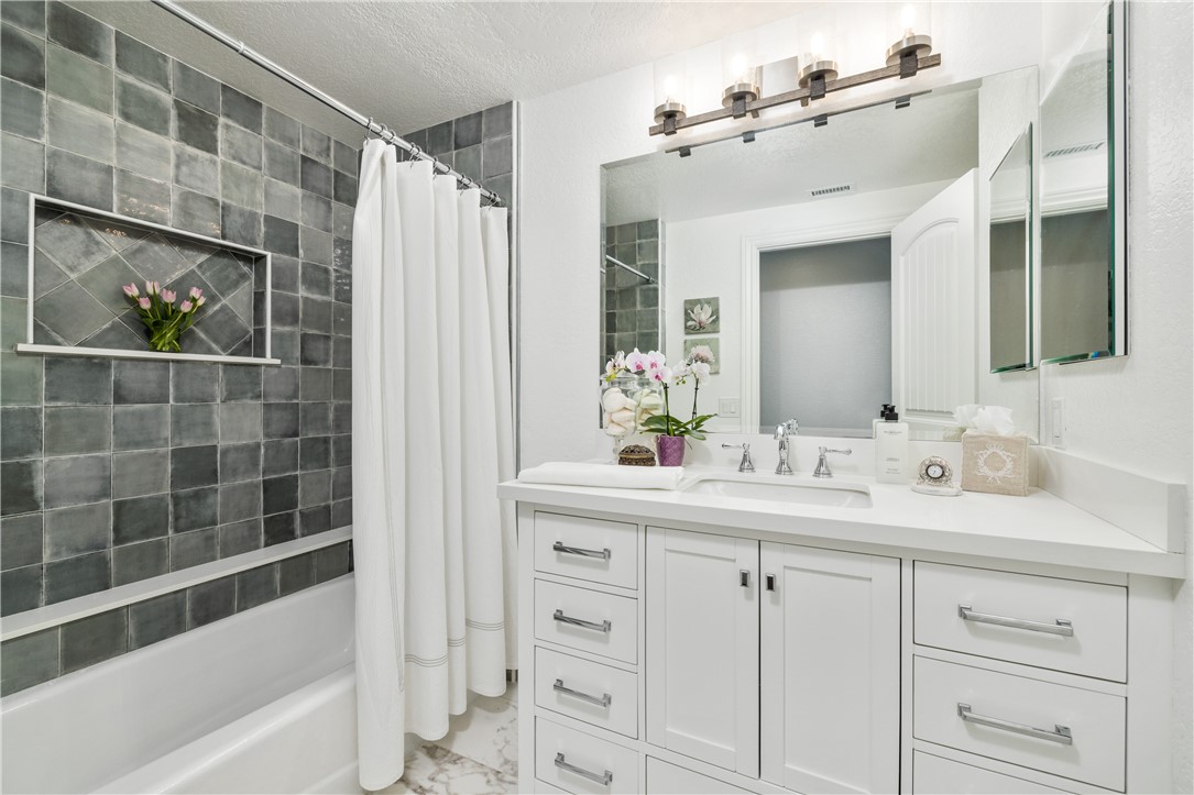 2126 Baseline Road La Verne, CA 91750 - Photo 26 of 39 a bathroom with a double vanity sink mirror and bathtub