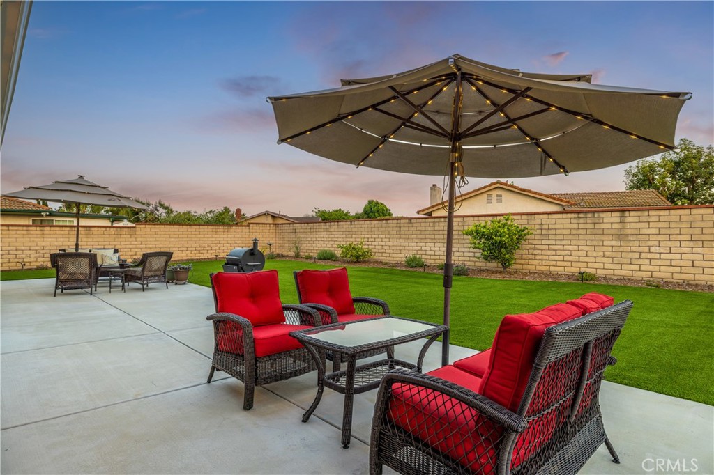 2126 Baseline Road La Verne, CA 91750 - Photo 34 of 39 an outdoor sitting area with furniture and umbrella