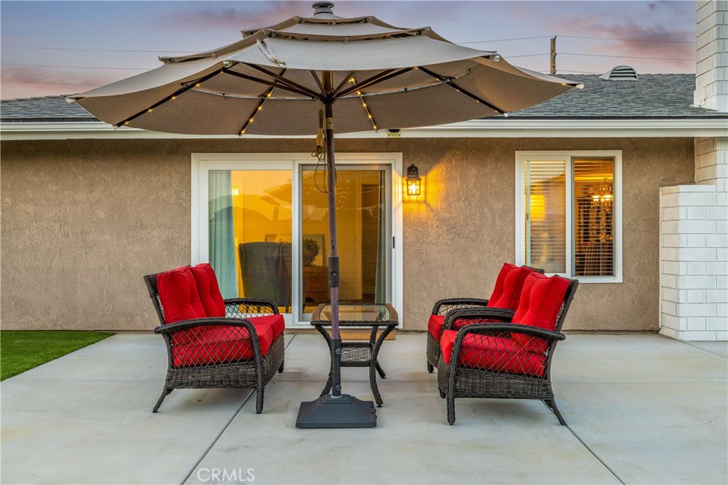 2126 Baseline Road La Verne, CA 91750 - Photo 35 of 39 a balcony with red chairs and a umbrella