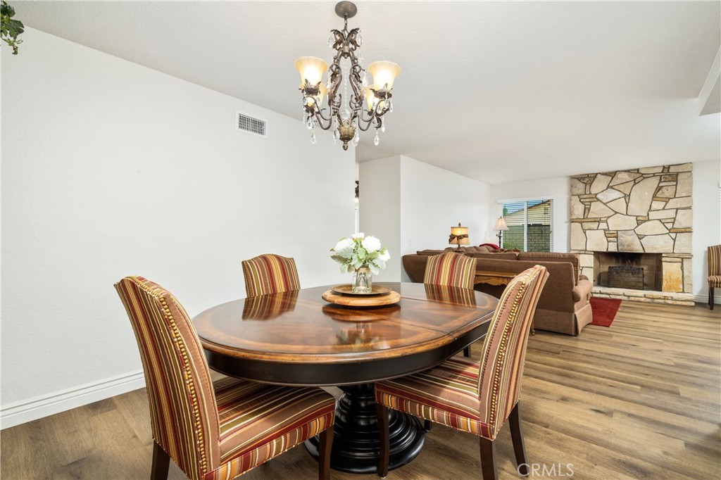 2126 Baseline Road La Verne, CA 91750 - Photo 9 of 39 a view of a dining room with furniture and wooden floor